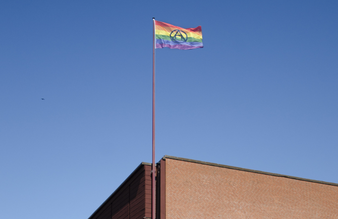 The rainbow flag raised at the union building. Photo.