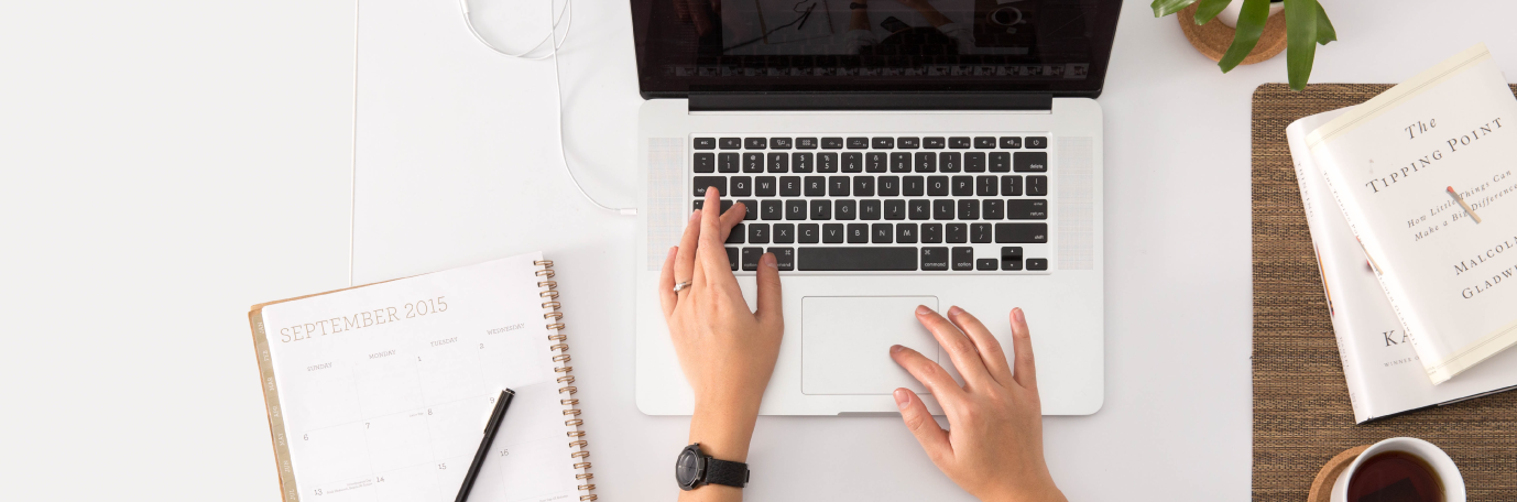 Student writing on a computer. Photo: Unsplash.